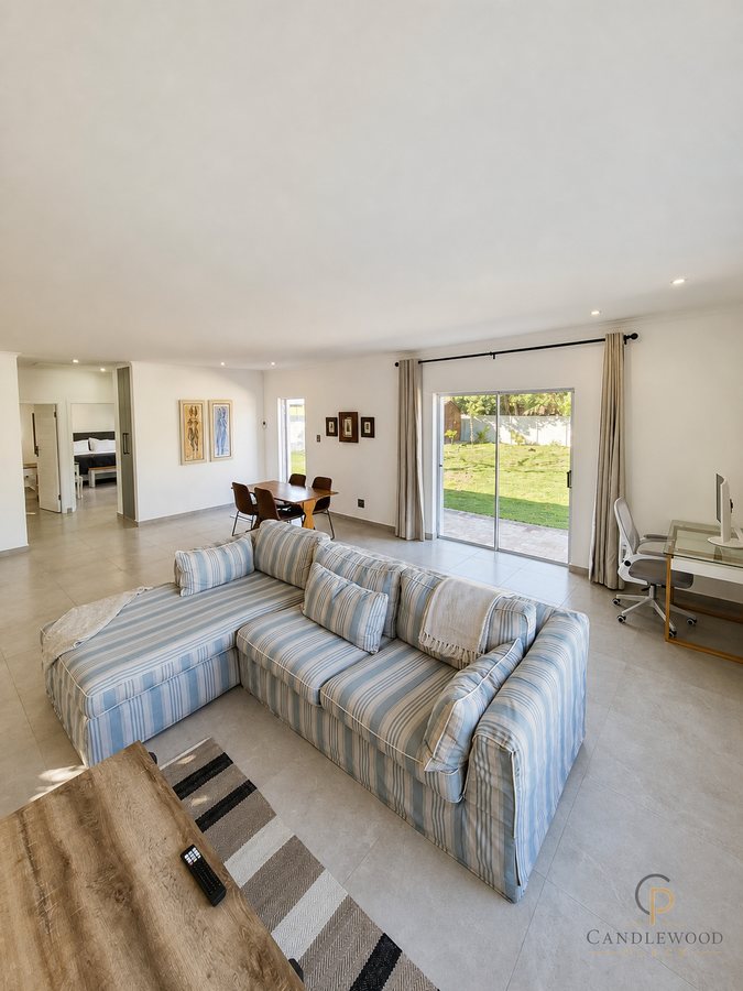 Lounge seating looking through to the dining table and garden